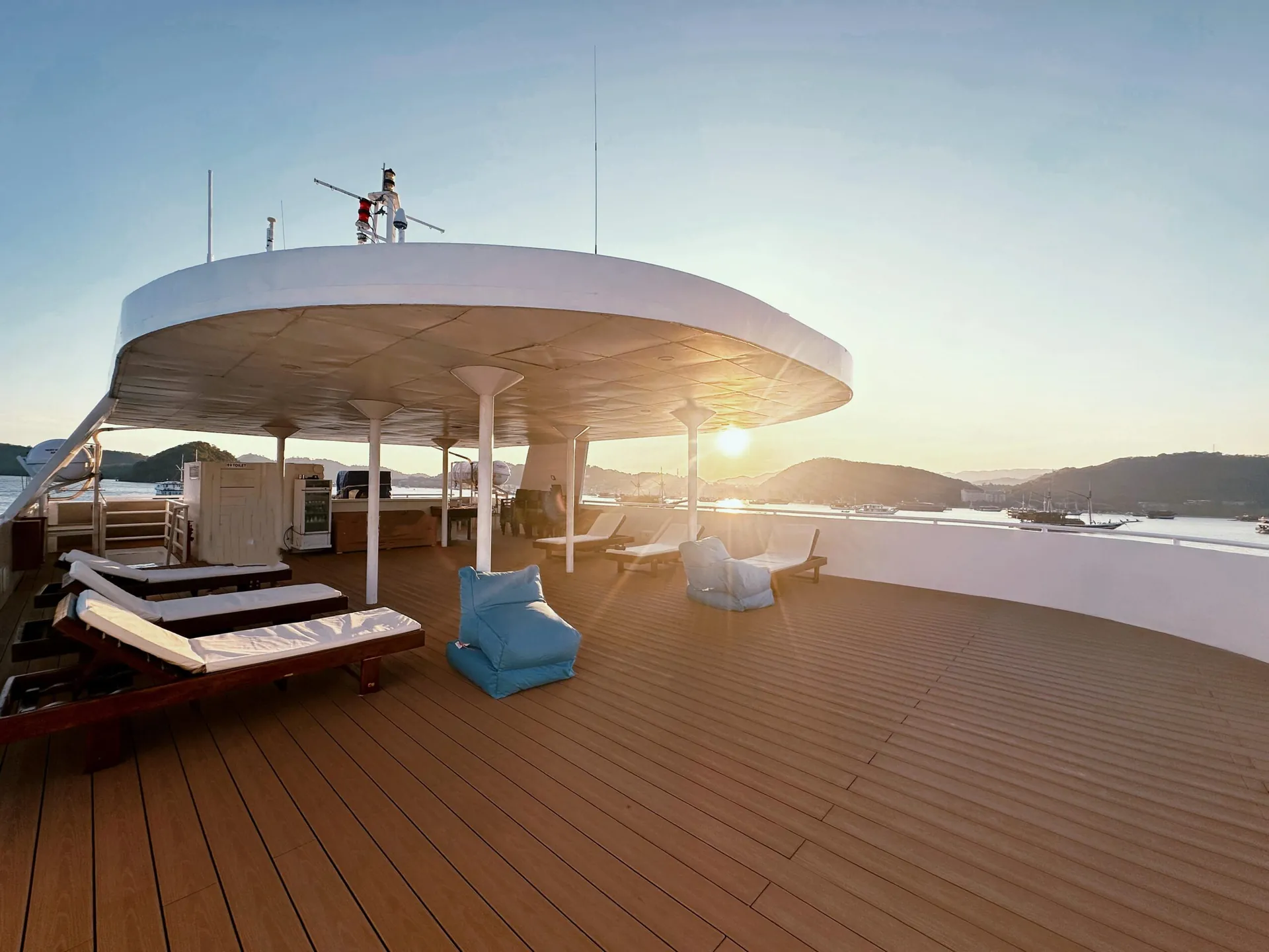 See I Sea upper sun deck with loungers at sunset